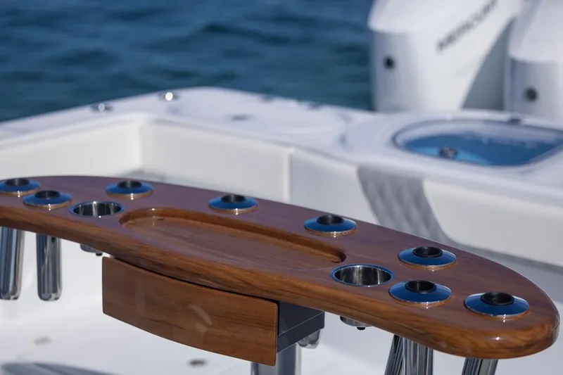Slide: The Image of Luxury fishing station on 2026 Invincible 46 Catamaran, featuring rod holders and teak finish. - 55