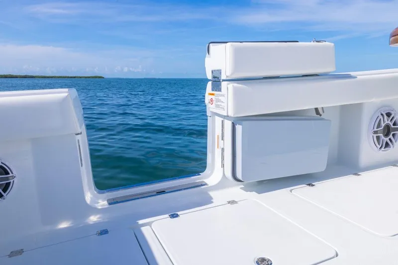 Slide: The Image of 2026 Invincible 46 Catamaran deck with ocean view and seating area. - 64