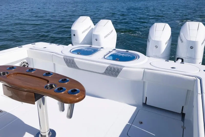 Slide: The Image of 2026 Invincible 46 Catamaran with Mercury engines, featuring a sleek fishing setup on open water. - 68