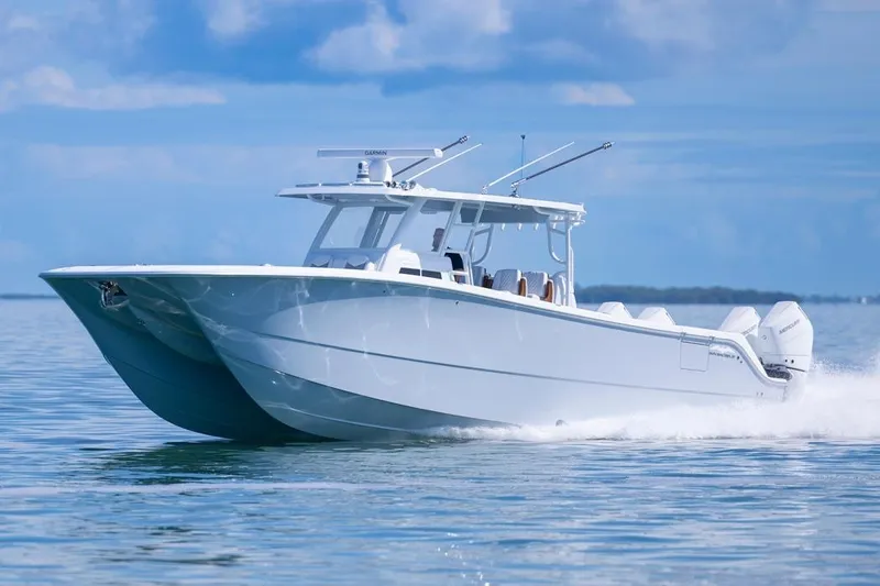 Slide: The Image of 2026 Invincible 46 Catamaran cruising on calm waters under a clear blue sky. - 7