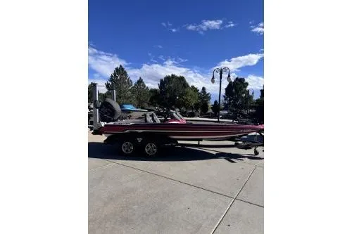 Slide: The Image of 2017 Skeeter FX21 boat on trailer under clear blue sky. - 3