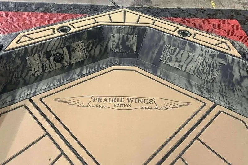 Slide: The Image of 2026 Tracker Grizzly 1650 T Prairie Wings Edition boat interior with camouflage design. - 4