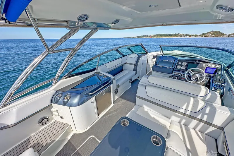 Slide: The Image of 2018 Formula 350 FX Crossover Bowrider interior with luxurious seating and modern dashboard. - 11