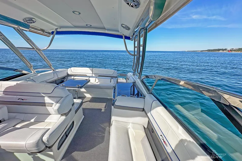 Slide: The Image of 2018 Formula 350 FX Crossover Bowrider on open water, featuring luxurious seating and sleek design. - 15