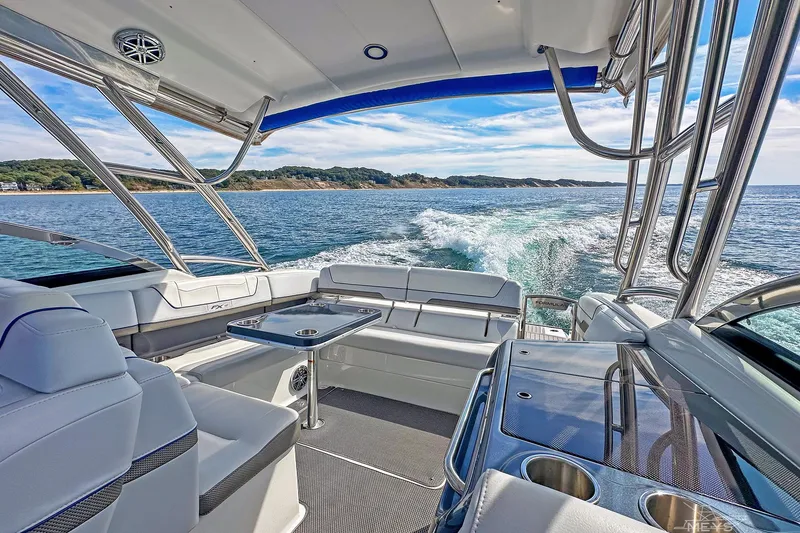 Slide: The Image of 2018 Formula 350 FX Crossover Bowrider cruising on open water, featuring luxurious seating. - 21