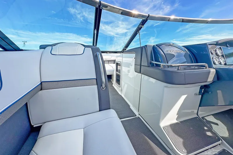 Slide: The Image of 2018 Formula 350 FX Crossover Bowrider interior with sleek seating and modern dashboard. - 22