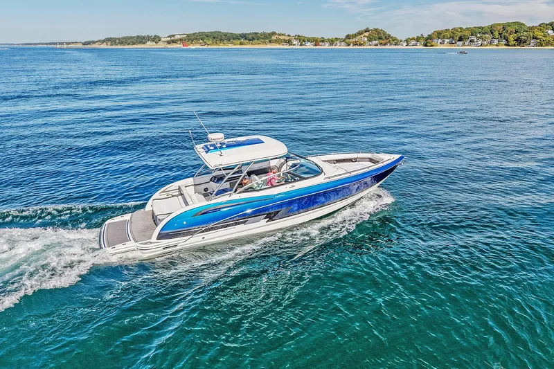 Slide: The Image of 2018 Formula 350 FX Crossover Bowrider cruising on clear blue water. - 24