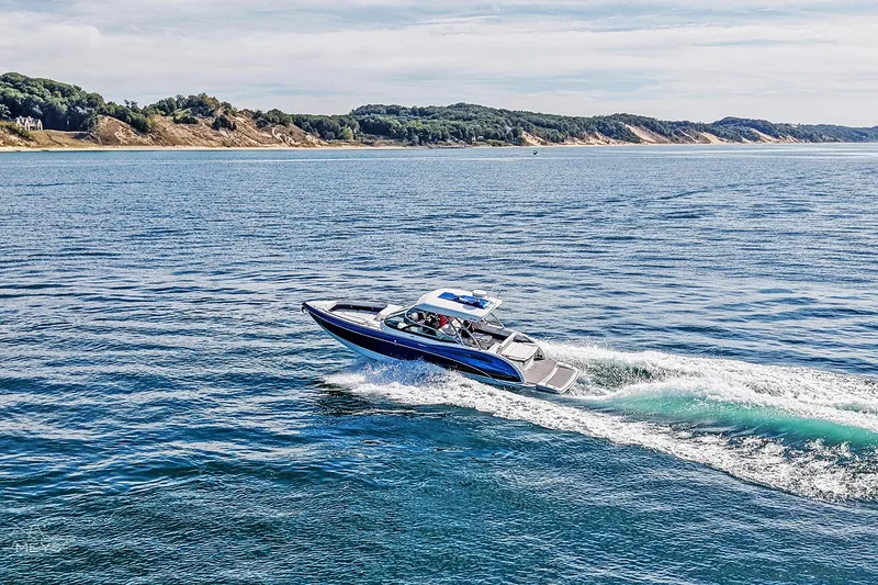 Slide: The Image of 2018 Formula 350 FX Crossover Bowrider cruising on scenic coastal waters. - 25