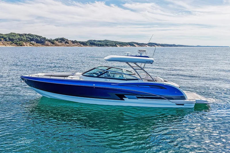 Slide: The Image of 2018 Formula 350 FX Crossover Bowrider on serene water with scenic coastline. - 5
