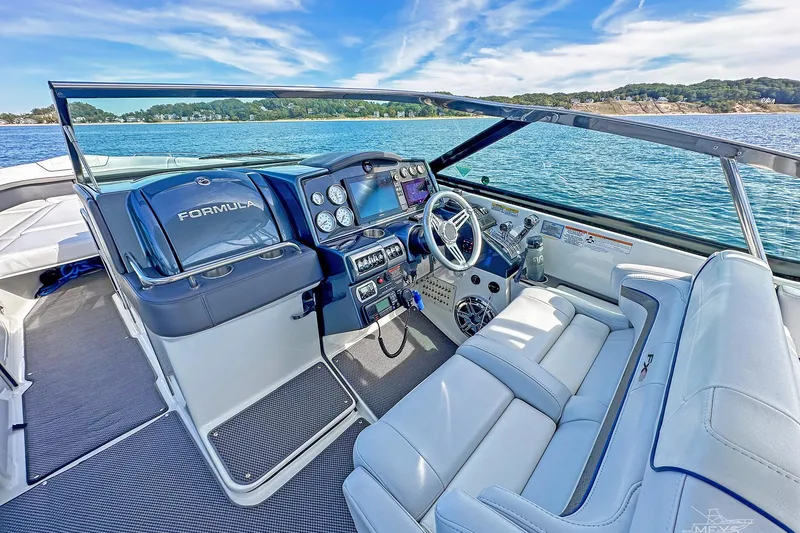 Slide: The Image of 2018 Formula 350 FX Crossover Bowrider interior with luxurious seating and modern dashboard. - 8