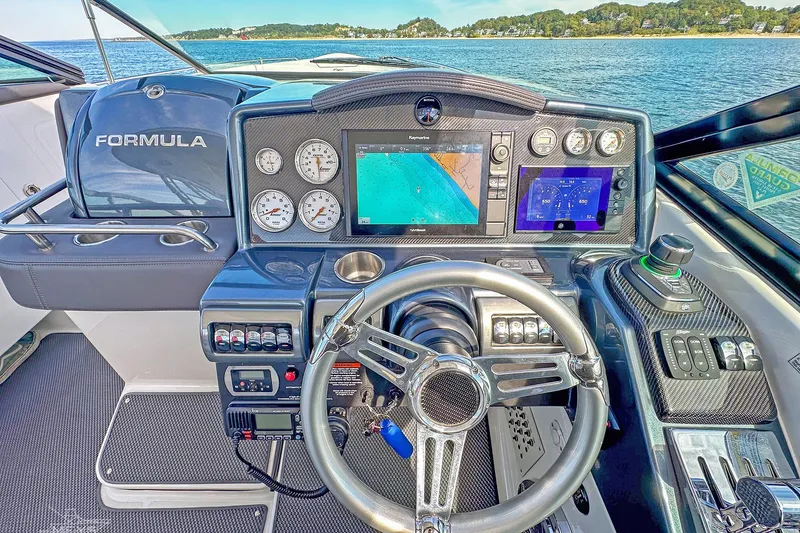 Slide: The Image of 2018 Formula 350 FX Crossover Bowrider dashboard with advanced navigation and control systems. - 9