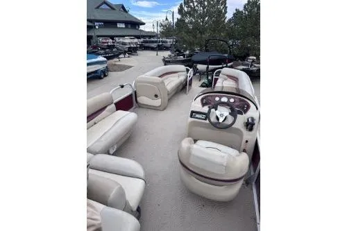 Slide: The Image of 2013 Sun Tracker Party Barge 22 DLX pontoon boat with spacious seating and steering console. - 5