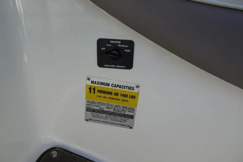 Slide: The Image of 2003 Cobalt 24SD boat capacity label, heater control, maximum 11 persons or 1450 lbs. - 14