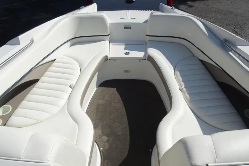 Slide: The Image of Interior view of a 2003 Cobalt 24SD boat with white seating. - 17