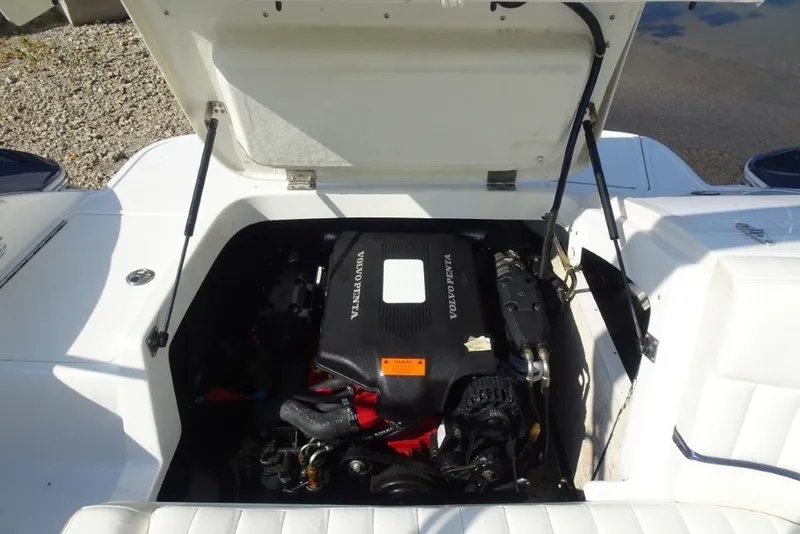 Slide: The Image of Open engine compartment of a 2003 Cobalt 24SD boat with Volvo Penta engine. - 21