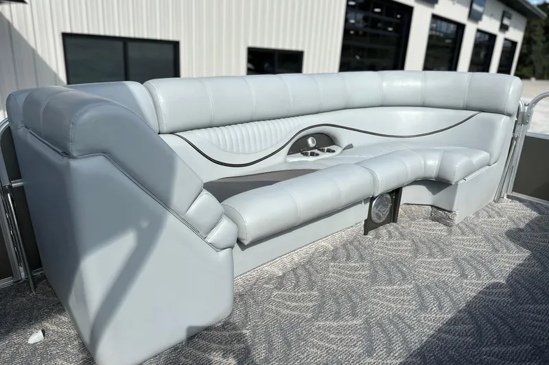 Slide: The Image of 2011 South Bay 925 CR boat interior with gray seating and carpeted flooring. - 17