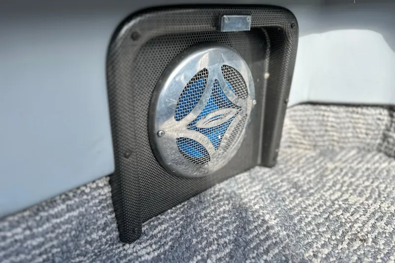 Slide: The Image of Speaker grille on 2011 South Bay 925 CR boat with carpeted flooring. - 18