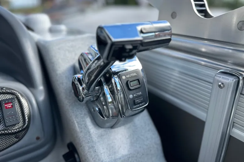 Slide: The Image of Close-up of 2011 South Bay 925 CR boat throttle control lever. - 24