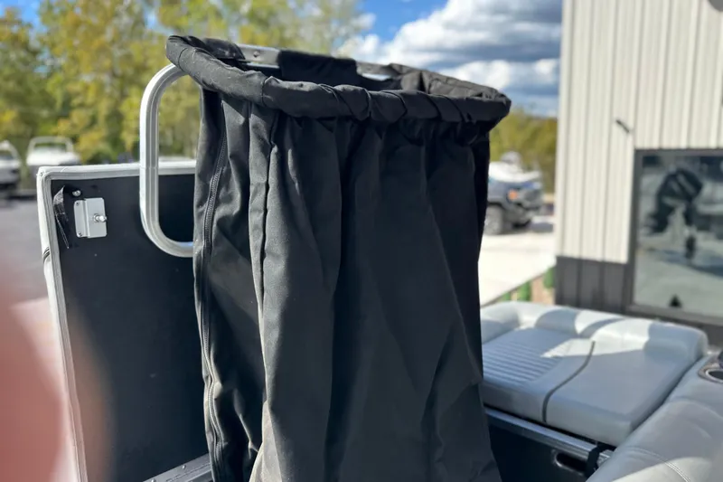 Slide: The Image of 2011 South Bay 925 CR boat with black fabric cover and seating area. - 29