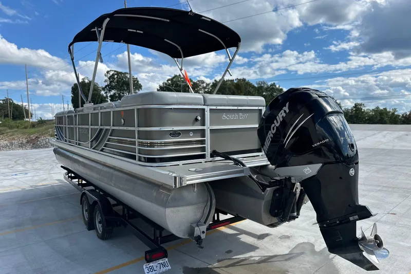 Slide: The Image of 2011 South Bay 925 CR pontoon boat with Mercury Verado engine on trailer. - 3