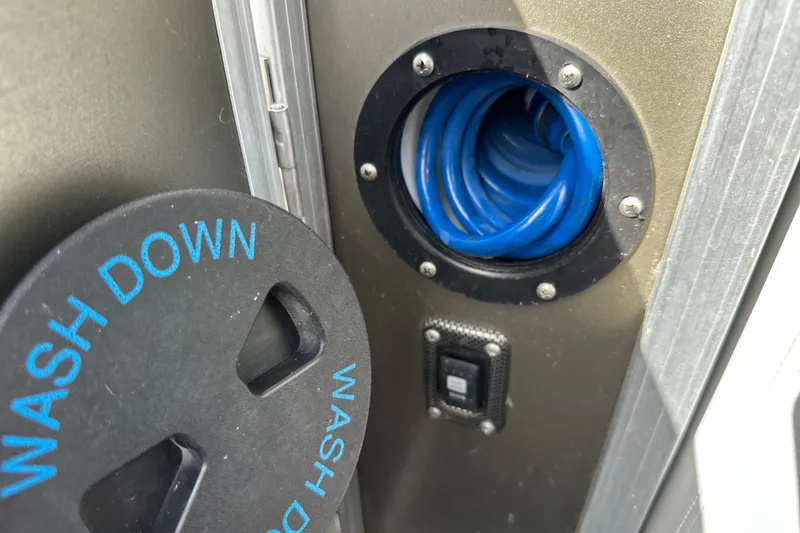 Slide: The Image of Wash down hose compartment on 2011 South Bay 925 CR boat. - 30