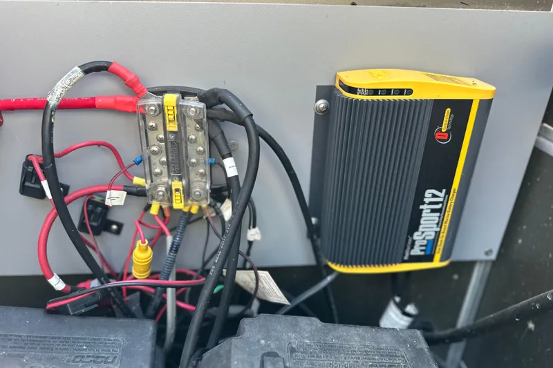 Slide: The Image of Electrical wiring and charger setup in a 2011 South Bay 925 CR boat. - 33