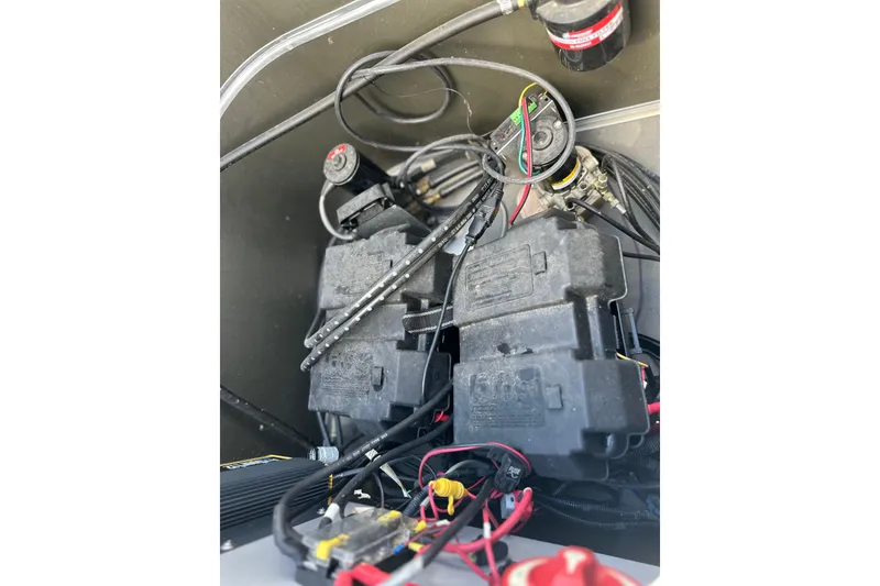 Slide: The Image of Battery compartment of a 2011 South Bay 925 CR boat with wiring and components. - 34
