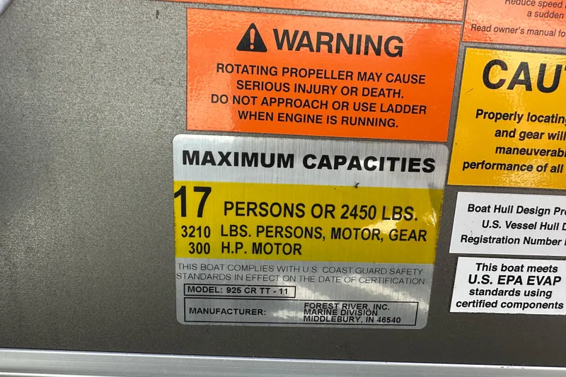Slide: The Image of Warning and capacity labels on 2011 South Bay 925 CR boat. - 35