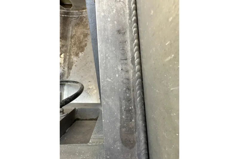 Slide: The Image of Close-up of a 2011 South Bay 925 CR boat's serial number on metal surface. - 37