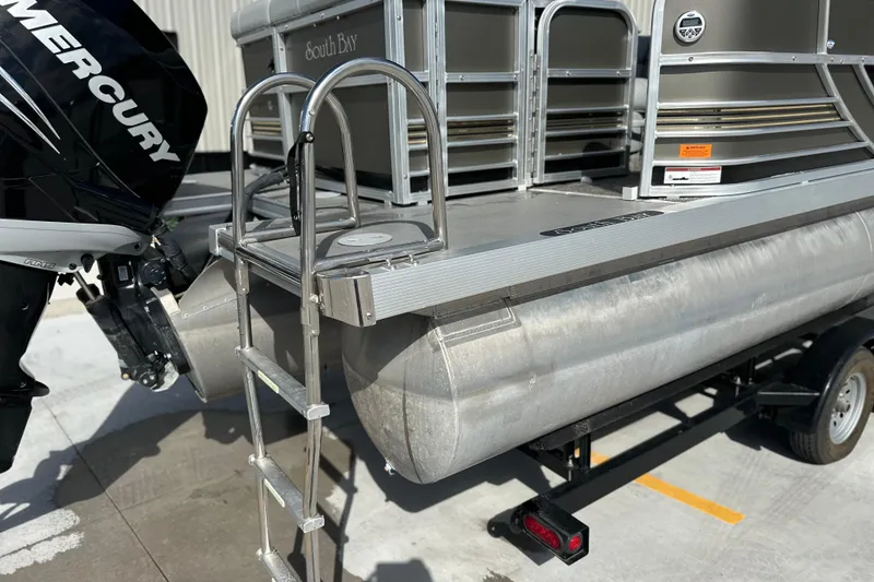 Slide: The Image of 2011 South Bay 925 CR pontoon boat with Mercury engine and boarding ladder. - 4