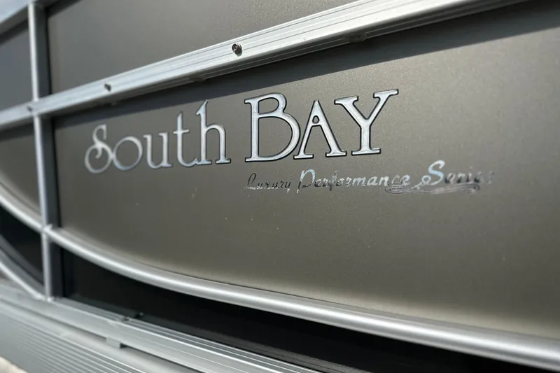 Slide: The Image of Close-up of 2011 South Bay 925 CR luxury performance series logo on boat exterior. - 5