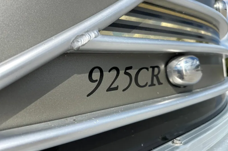Slide: The Image of Close-up of 2011 South Bay 925 CR boat model emblem and railing. - 6
