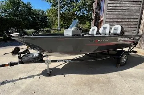 Slide: The Image of 2019 Tracker Pro Guide V-16 SC boat on trailer, parked outdoors. - 2