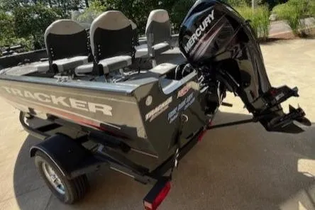 Slide: The Image of 2019 Tracker Pro Guide V-16 SC boat with Mercury outboard motor on trailer. - 3