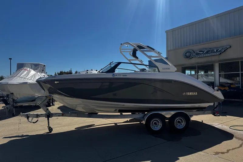 Slide: The Image of 2026 Yamaha Boat 222SE on trailer, parked outdoors under clear blue sky. - 3