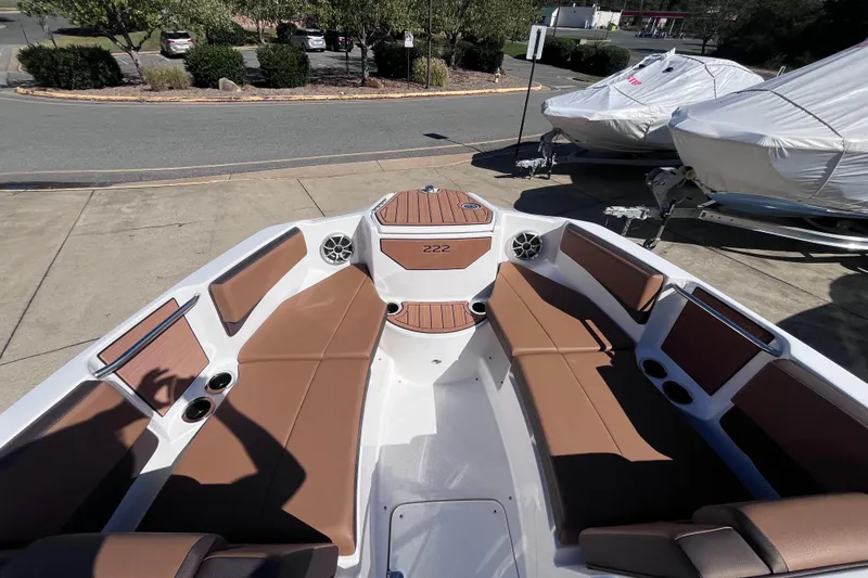 Slide: The Image of 2026 Yamaha Boat 222SE interior with brown seating and modern design. - 8
