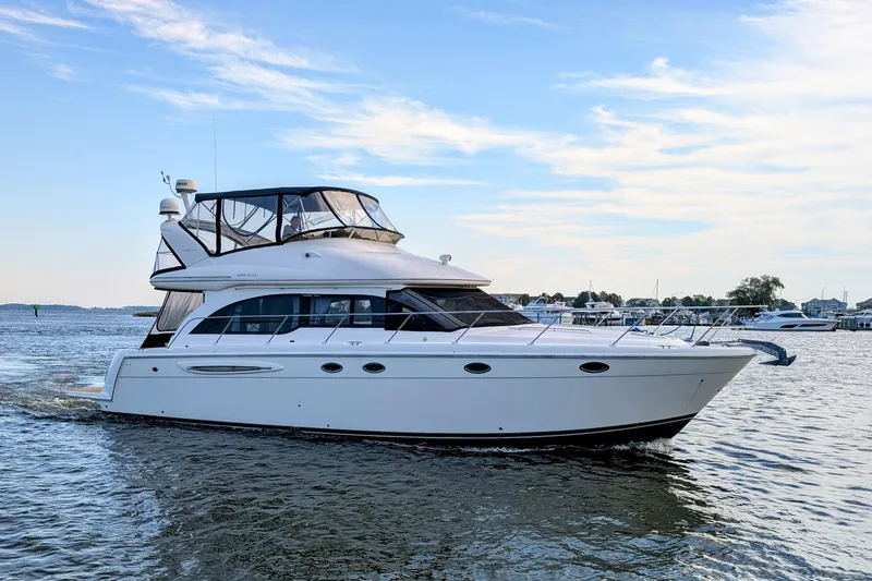 The Image of 2006 Meridian 411 Sedan yacht cruising on calm waters under a clear sky. - 0