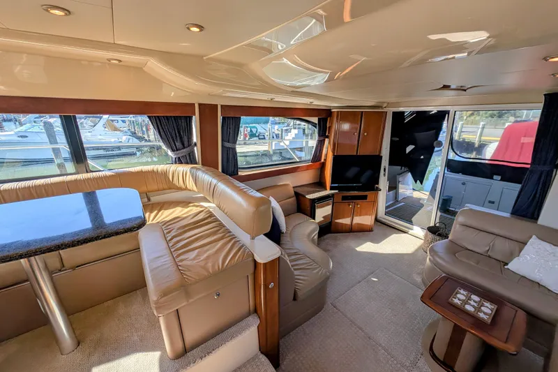 Slide: The Image of Luxurious interior of a 2006 Meridian 411 Sedan yacht with leather seating and modern amenities. - 12