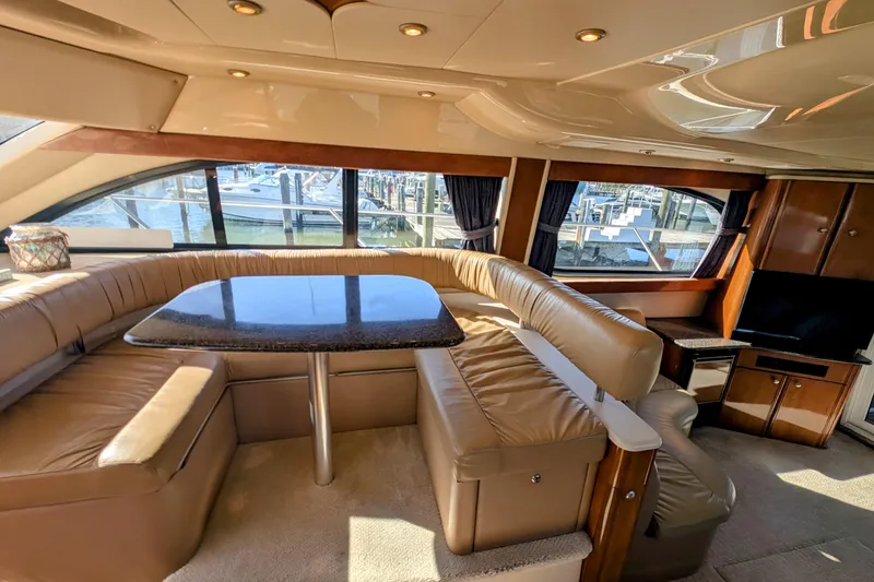 Slide: The Image of Luxurious interior of a 2006 Meridian 411 Sedan yacht with leather seating and panoramic windows. - 13