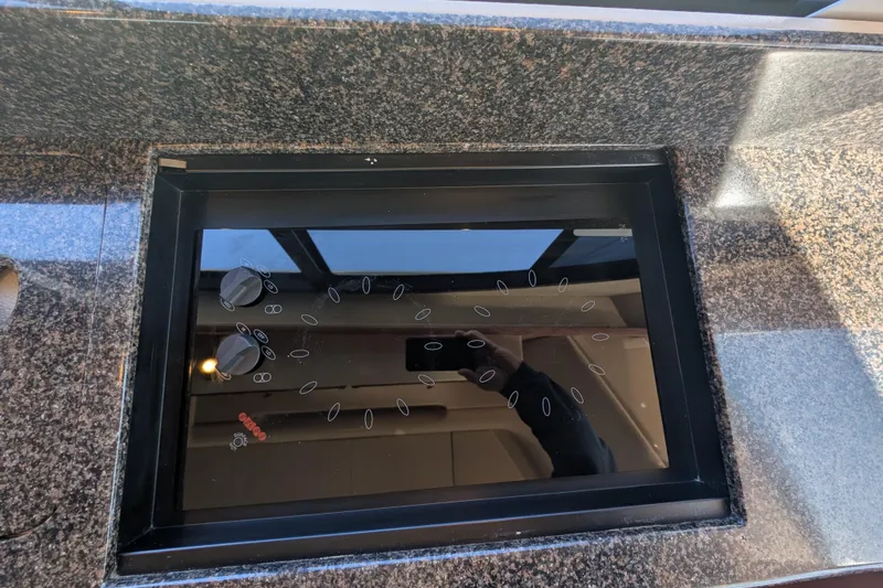 Slide: The Image of Granite countertop with a sleek black cooktop on a 2006 Meridian 411 Sedan. - 15
