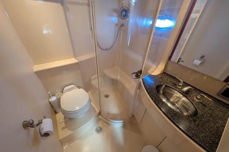 Slide: The Image of Luxurious bathroom in 2006 Meridian 411 Sedan yacht with shower and granite sink. - 25