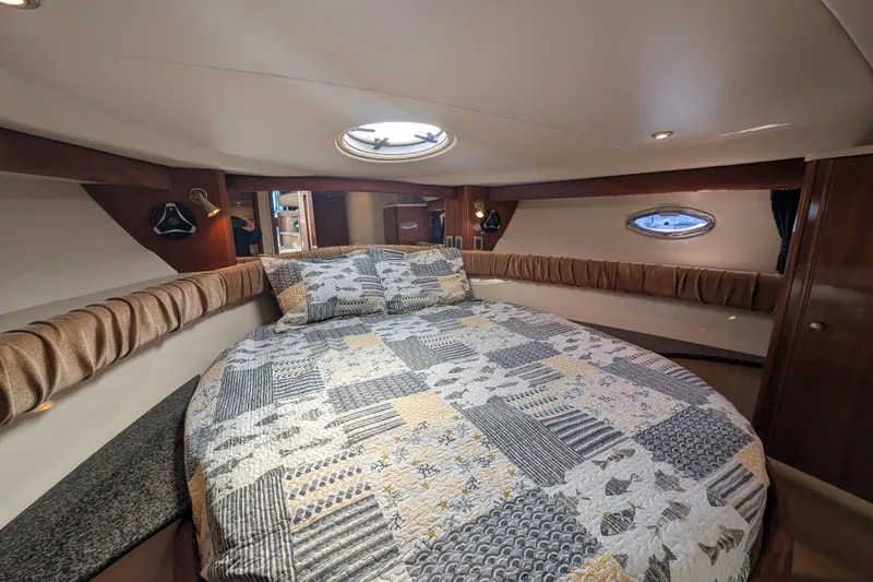 Slide: The Image of Luxurious bedroom interior of 2006 Meridian 411 Sedan yacht with quilted bedding. - 26