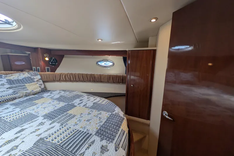 Slide: The Image of Luxurious cabin interior of 2006 Meridian 411 Sedan yacht with quilted bedding. - 27