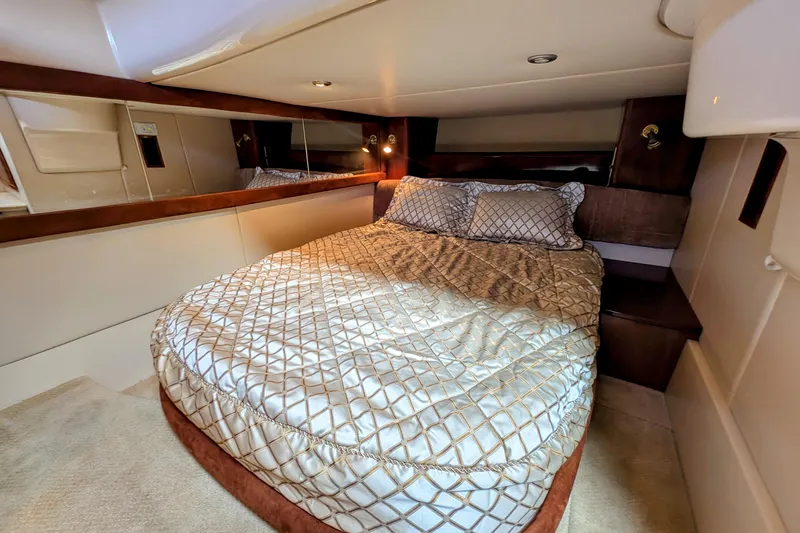 Slide: The Image of Luxurious bedroom interior of 2006 Meridian 411 Sedan yacht with elegant bedding. - 30