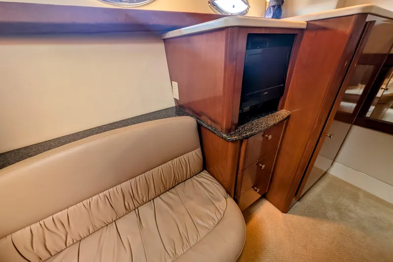 Slide: The Image of 2006 Meridian 411 Sedan interior with beige seating and wooden cabinetry. - 31
