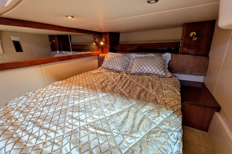 Slide: The Image of Luxurious bedroom interior of 2006 Meridian 411 Sedan yacht with elegant bedding. - 32