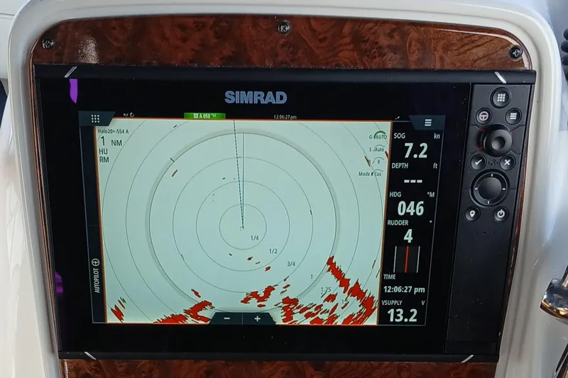 Slide: The Image of Simrad marine radar display on 2006 Meridian 411 Sedan, showing navigation and speed data. - 37