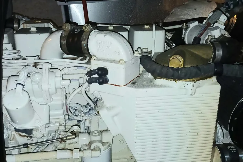 Slide: The Image of Engine compartment of a 2006 Meridian 411 Sedan boat, showcasing mechanical components. - 48