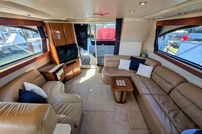 Slide: The Image of Luxurious interior of 2006 Meridian 411 Sedan yacht with leather seating and entertainment area. - 7