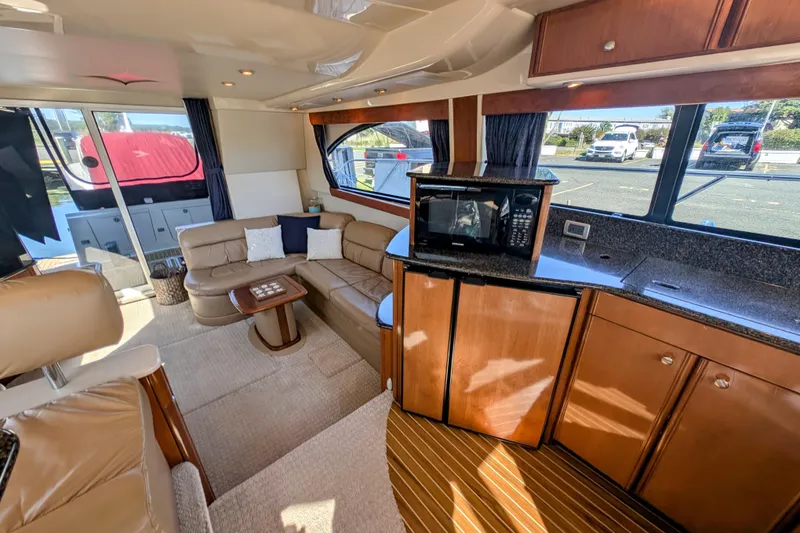 Slide: The Image of Luxurious interior of a 2006 Meridian 411 Sedan yacht with leather seating and modern amenities. - 8